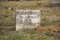 OLD TOMBSTONE WITH CROSS AND ARABIC WRITING