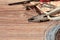 Old tools on a wooden background. Pliers, screwdriver, nails and wire on a wooden background