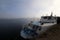 An old tourist pleasure boat is moored to the pier.