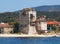 Old tower in the port of Ouranoupolis city (Greece) - gate of Mount Athos