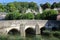 The Old Town Bridge on the river Avon with the bell tower of St Thomas More`s Catholic Church in the background, Bradford on Avon,