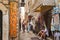 Old town in Budva. Ancient Romanesque houses, stone streets. Tourists. Shops and cafes. Montenegro, Balkans. Summer.