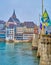 Old Town district with Martin`s Church on the hill and Mittlere Brucke across Rhine river, on April 1 in Basel, Switzerland