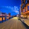 Old town in Gdansk with historical port crane over Motlawa river at dusk, Poland