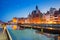 Old town of Gdansk reflected in Motlawa river at dusk, Poland