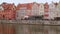 Old town in Gdansk. The riverside on Granary Island reflection in Moltawa River Cityscap. Ancient crane at dusk. Visit