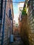 Old town narrow street with stairs, doors, windows and flower garlands Croatia