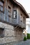 Old Town of Nesebar. Authentic wooden facade of a Bulgarian house. ground floor made of stone