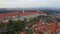 Old town Prague pan aerial view, red rooftops, city Castle