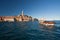 The old town Rovinj with motorboat