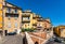 Old town south slope with historic tenement houses and walls over Bulevard Fragonard street in perfumery city of Grasse in France