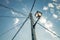 Old town street lamp  with tangled power cables under a blue sunny sky with scattered clouds in castilla la mancha, spain