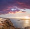 Old Town Thira on the Santorini island, famous churches against colorful sunset in Greece