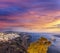 Old Town Thira on the Santorini island, famous churches against colorful sunset in Greece