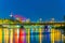 the old town of Warsaw reflected on the Vistula river with the slasko-dabrowski bridge during night, Poland....IMAGE