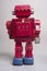 Old toy from the 1950s of a lonely and paradi robot made of red tin, battery operated,