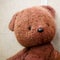 Old toy - vintage plush brown bear. Portrait. Shallow depth of field