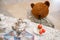 Old toy - a vintage plush brown bear sits at a puppet table. Subject from the past