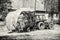 Old tractor with hay, agricultural scene, colorless