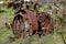 An old tractor with lug wheel and a fender cover