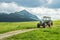 Old tractor on meadow. Beautiful mountain view in the Alps