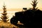 Old tractor parked on a hilltop above dense fog in the valley below.