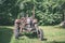 old tractor with rubber tires in green countryside yard in green summer - vintage retro film look