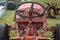 Old tractor wheel closeup, rusted and weathered