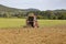 Old tractor working on the field