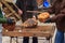 Old tradition in the rural side of Romanian villages, beating the bread. Once the bread is taken out of wooden owens the burned