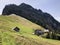 Old traditional architecture and farmhouse on the slopes of Vitznauerstock peak