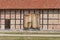 Old traditional barn with big wooden doors in the Polish countryside