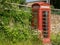 Old traditional British telephone box in Naunton, The Cotswolds, UK