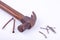 old Traditional curved claw hammer and rust nail tack used on white background tool isolated