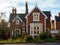 Old traditional English honey golden brown stoned cottage with front garden in Mount Dinham, Exeter, Devon, United Kingdom,