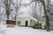 An old, traditional house in small village during heavy snow fall in Hungary