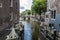 Old traditional leaning houses along a canal in Amsterdam, Netherlands