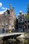 Old traditional leaning houses along the canal in Amsterdam, Netherlands