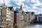 Old traditional leaning houses along the canal in Amsterdam, Netherlands