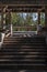 An old traditional stone staircase or rocks stairs to the old pavilion and surrounding green trees