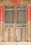 The old traditional style wood carving door with Spring festival couplets during Chinese new year