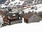 Old traditional swiss rural architecture and alpine livestock farms in the winter ambience of the region over the Lake Walen