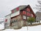 Old traditional swiss rural architecture and alpine livestock farms in the winter ambience of the region over the Lake Walen