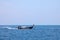 Old traditional Thai motorboat made of wood for fishing and transporting tourists on excursions in the Andaman Sea in clear