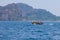 Old traditional Thai motorboat made of wood for fishing and transporting tourists on excursions in the Andaman Sea in clear