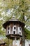 Old traditional ukrainian wooden beehive with tree background