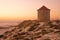 Old traditional wind-mills in sand-hills of Apulia Portugal