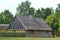 Old traditional wooden family house with straw roof in the Polish countryside