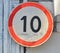 Old traffic sign restricting speed to10 kilometers per hour