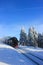 An old train rides on rails in winter. Snow-covered Brockenbahn or Brocken Railway, in winter, on top of Brocken Mountain, Harz